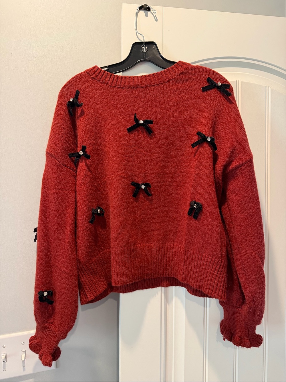 entro Red Crewneck Sweater with Black Bow Embellishments